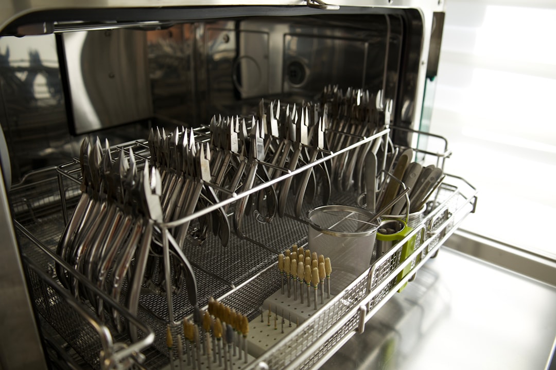 Open dishwasher rack during an in-home appliance repair call in Jackson, Tennessee
